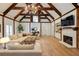 Elegant living room with a cozy fireplace, hardwood floors, and stylish decor at 2190 Spalding Dr, Sandy Springs, GA 30350