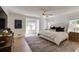 Spacious main bedroom with large windows, hardwood floors, and neutral decor at 2190 Spalding Dr, Sandy Springs, GA 30350
