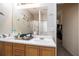 Bathroom featuring a double sink vanity with a large mirror and lots of counter space at 4415 Roche St, Atlanta, GA 30349