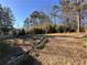 Large backyard with ample space, mature trees, and privacy at 4828 Lakewood Dr, Acworth, GA 30101