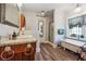 Charming bathroom with a clawfoot tub, wood-look floor, and bright window with gingham valance at 4828 Lakewood Dr, Acworth, GA 30101