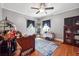 Cozy bedroom with hardwood floors, bright windows, and decorative accents at 4828 Lakewood Dr, Acworth, GA 30101