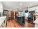 Farmhouse kitchen boasts stainless appliances, marble countertops, and an island with open storage at 4828 Lakewood Dr, Acworth, GA 30101