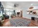 Open-concept living area showcasing hardwood floors, comfortable seating, and a view into the kitchen at 4828 Lakewood Dr, Acworth, GA 30101