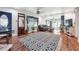 Inviting living room with hardwood floors, a large patterned rug, and comfortable seating area at 4828 Lakewood Dr, Acworth, GA 30101