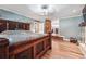 Main bedroom boasts hardwood floors, a decorative light fixture, and an ensuite bathroom at 4828 Lakewood Dr, Acworth, GA 30101