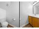 Half bathroom featuring hardwood style floor and oak vanity at 5915 Trent Walk Dr, Lithonia, GA 30038