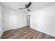 Bedroom featuring hardwood-style floors, neutral paint, and a closet at 5915 Trent Walk Dr, Lithonia, GA 30038
