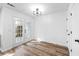 Dining area featuring French doors, stylish lighting, and access to outdoor space at 5915 Trent Walk Dr, Lithonia, GA 30038