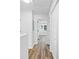 Upstairs hallway featuring hardwood style floors and a large closet at 5915 Trent Walk Dr, Lithonia, GA 30038