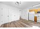 Bright kitchen featuring white appliances and hardwood-style floors at 5915 Trent Walk Dr, Lithonia, GA 30038