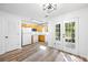 Bright kitchen features white appliances and natural wood-toned cabinets at 5915 Trent Walk Dr, Lithonia, GA 30038