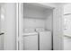 Closet laundry room featuring stacked washer and dryer units at 5915 Trent Walk Dr, Lithonia, GA 30038
