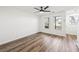 Spacious living room with hardwood floors, ceiling fan, and natural light at 5915 Trent Walk Dr, Lithonia, GA 30038