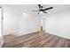 Bright living room with wood-look flooring, staircase, and ample natural light at 5915 Trent Walk Dr, Lithonia, GA 30038