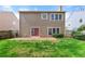 Backyard with a well-maintained lawn, patio area and privacy fence, perfect for outdoor entertaining and relaxation at 2829 Priestcliff Se Dr, Smyrna, GA 30080