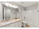 Bright bathroom with double sinks, granite countertops, and a tub-shower combo at 2829 Priestcliff Se Dr, Smyrna, GA 30080