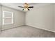A comfortable bedroom with carpet, a ceiling fan and natural light from a window at 2829 Priestcliff Se Dr, Smyrna, GA 30080