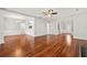 Open-concept living space with hardwood floors, light grey walls, and views of the entry at 2829 Priestcliff Se Dr, Smyrna, GA 30080