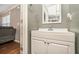 Cozy bathroom with white vanity, modern faucet, and gray walls at 5987 Westchase St, Atlanta, GA 30336