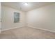 Neutral bedroom with carpet, ceiling light, and window at 5987 Westchase St, Atlanta, GA 30336