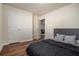 Bedroom boasts wood-look flooring, closet, and ample natural light at 5987 Westchase St, Atlanta, GA 30336