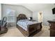 Spacious bedroom features a decorative headboard, neutral carpeting, and ample natural light at 5987 Westchase St, Atlanta, GA 30336