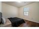 Modern bedroom with wood-look flooring, closet, and window at 5987 Westchase St, Atlanta, GA 30336