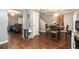 Dining room with hardwood floors, modern chandelier, and a view into the living room at 5987 Westchase St, Atlanta, GA 30336