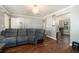 Inviting living room with hardwood floors, gray walls, and access to the dining room at 5987 Westchase St, Atlanta, GA 30336