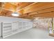 Unfinished basement with exposed ceiling and shelving for storage at 650 Glen Iris Ne Dr # 15, Atlanta, GA 30308