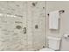 Close up of bathroom featuring glass shower, marble tiling and modern fixtures at 650 Glen Iris Ne Dr # 15, Atlanta, GA 30308