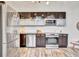 Modern kitchen features stainless steel appliances, dark cabinets, and a subway tile backsplash at 650 Glen Iris Ne Dr # 15, Atlanta, GA 30308