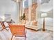 Bright living room boasts hardwood floors, exposed brick, and designer furnishings at 650 Glen Iris Ne Dr # 15, Atlanta, GA 30308