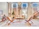 Bright living room boasts hardwood floors, exposed brick, and designer furnishings at 650 Glen Iris Ne Dr # 15, Atlanta, GA 30308
