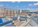 Rooftop terrace with comfortable lounge seating and string lights offering an ideal outdoor retreat at 650 Glen Iris Ne Dr # 15, Atlanta, GA 30308