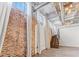 Unique staircase with exposed brick, modern lighting, and hardwood floors at 650 Glen Iris Ne Dr # 15, Atlanta, GA 30308