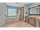 Bright bathroom featuring walk-in shower, soaking tub, granite counters and blue walls at 10780 S Kimball Bridge Xing, Alpharetta, GA 30022