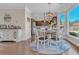 Inviting dining area with a view of the backyard and access to the kitchen at 10780 S Kimball Bridge Xing, Alpharetta, GA 30022