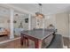 Open floor plan in the game room leading to a connected and inviting living space at 10780 S Kimball Bridge Xing, Alpharetta, GA 30022