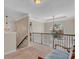 Second story landing with metal railing and natural light from a large window at 10780 S Kimball Bridge Xing, Alpharetta, GA 30022