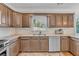 Well-equipped kitchen featuring granite countertops, tiled backsplash, and stainless steel appliances at 10780 S Kimball Bridge Xing, Alpharetta, GA 30022