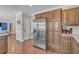 Kitchen with stainless steel appliances and a view of the living room at 10780 S Kimball Bridge Xing, Alpharetta, GA 30022