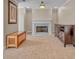 Cozy living room features a fireplace, neutral carpet, and custom built-in storage at 10780 S Kimball Bridge Xing, Alpharetta, GA 30022