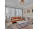 Cozy living room featuring neutral tones, comfortable seating, and a stylish marble coffee table at 10780 S Kimball Bridge Xing, Alpharetta, GA 30022