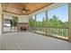 Enclosed back porch features a fan, a fireplace, and beautiful views of the wooded backyard at 112 Dallas Mark Drive, Canton, GA 30115