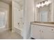 Bathroom with a tub-shower combo featuring white subway tile, complemented by a vanity with ample storage at 112 Dallas Mark Drive, Canton, GA 30115