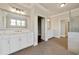 Well-lit bathroom with double vanity, modern fixtures, and tile flooring with access to a glass shower at 112 Dallas Mark Drive, Canton, GA 30115