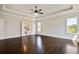 Bedroom with hardwood floors and double doors to the bathroom with a soaking tub at 112 Dallas Mark Drive, Canton, GA 30115