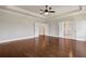 Bedroom with hardwood floors and double doors that lead to bathrooms on either side at 112 Dallas Mark Drive, Canton, GA 30115